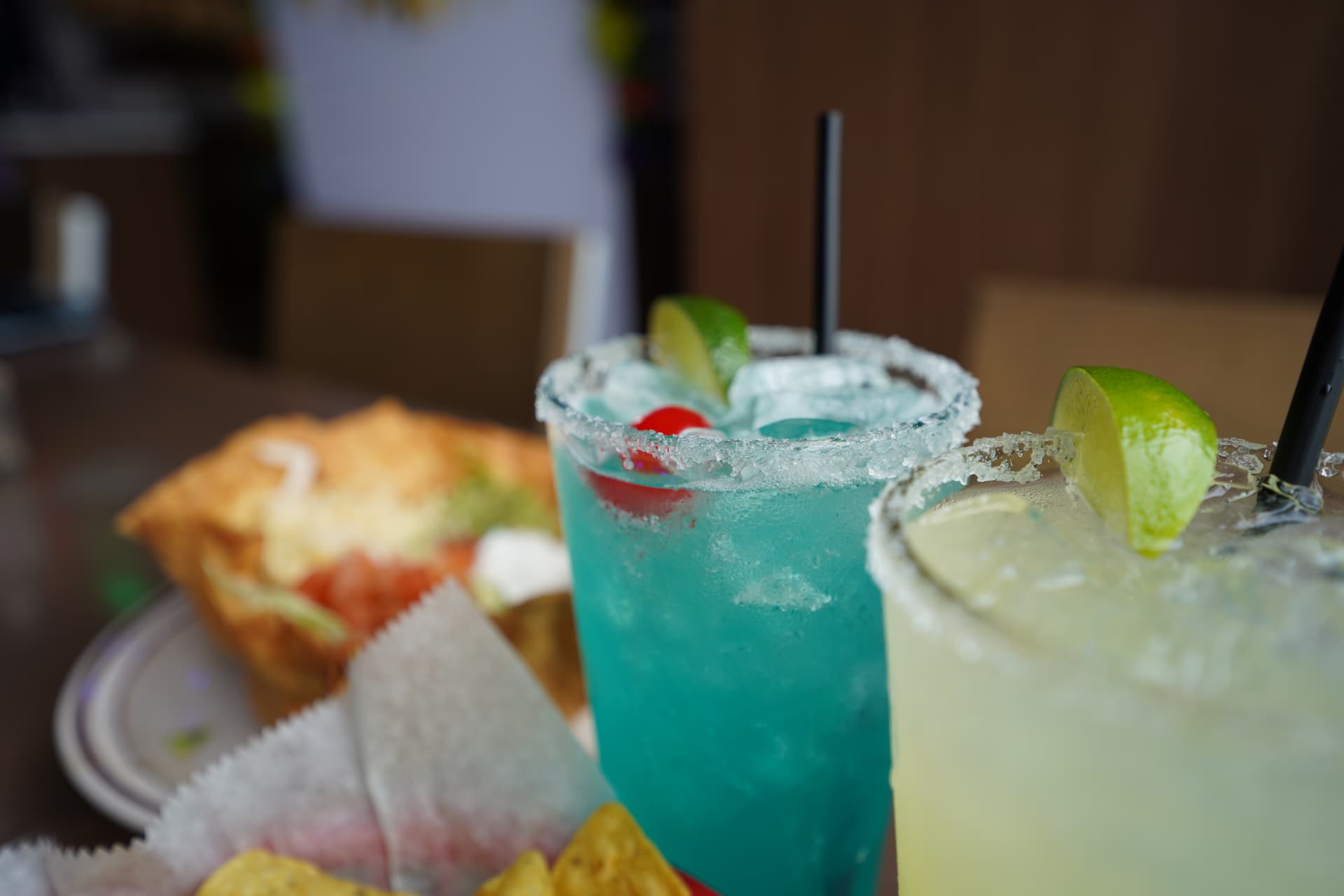 Blue and classic lime margaritas with salted rims
